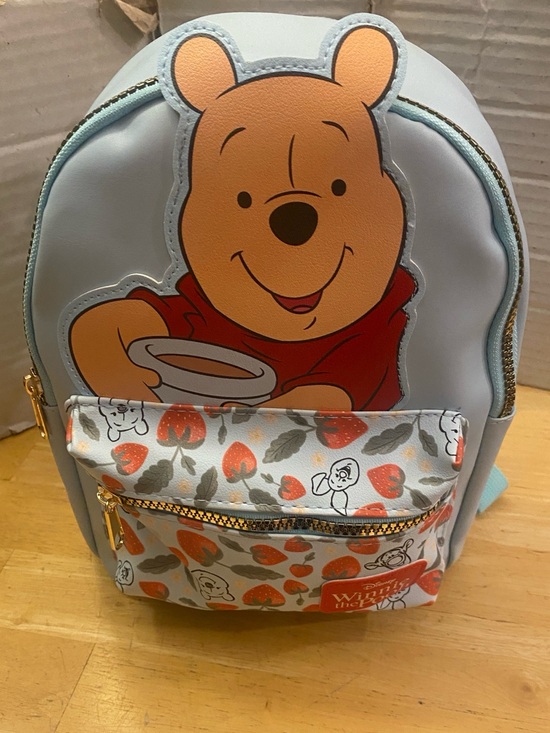 Disney Handbags - Disney Winnie the Pooh Blue mini Backpack w front zippered pocket w strawberries